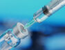 Medical disposable syringe for vaccine injection and glass vial.