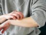 Woman scratching her arm (1)