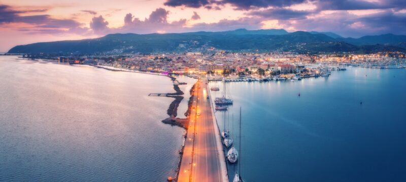 Aerial,View,Of,Road,Near,Sea,Canal,At,Night,In
