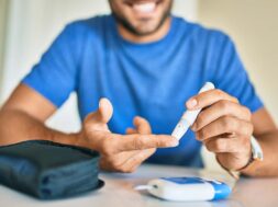 Young,Hispanic,Diabetic,Man,Measuring,Glucose,Level,At,Home