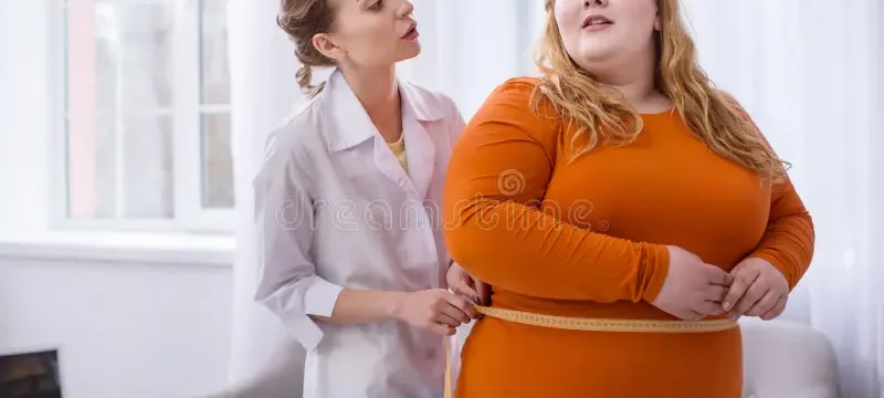 big-weight-serious-professional-doctor-talking-fat-women-measuring-her-concentrated-doctor-talking-plump-woman-116344438