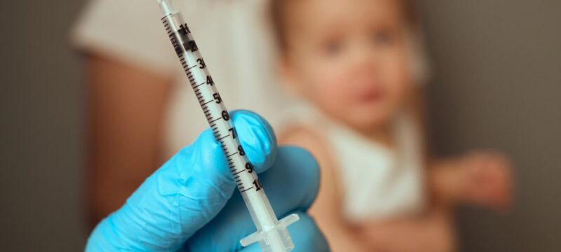 Child vaccination blurry background
