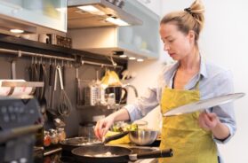 woman-preparing-food-kitchen_1048944-12756430